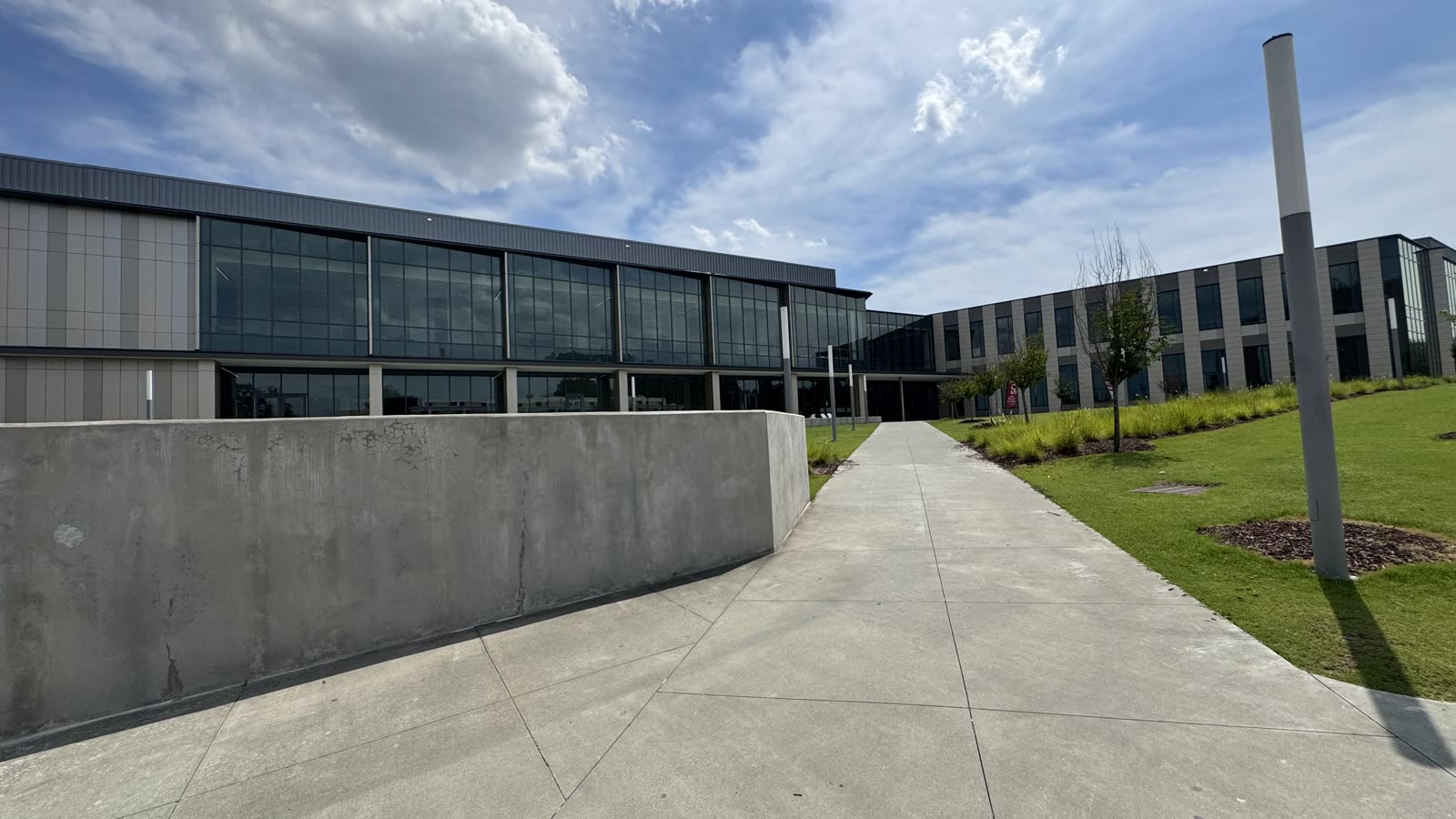Walkway leading to the glass-and-steel entrance of the NCCU Student Center