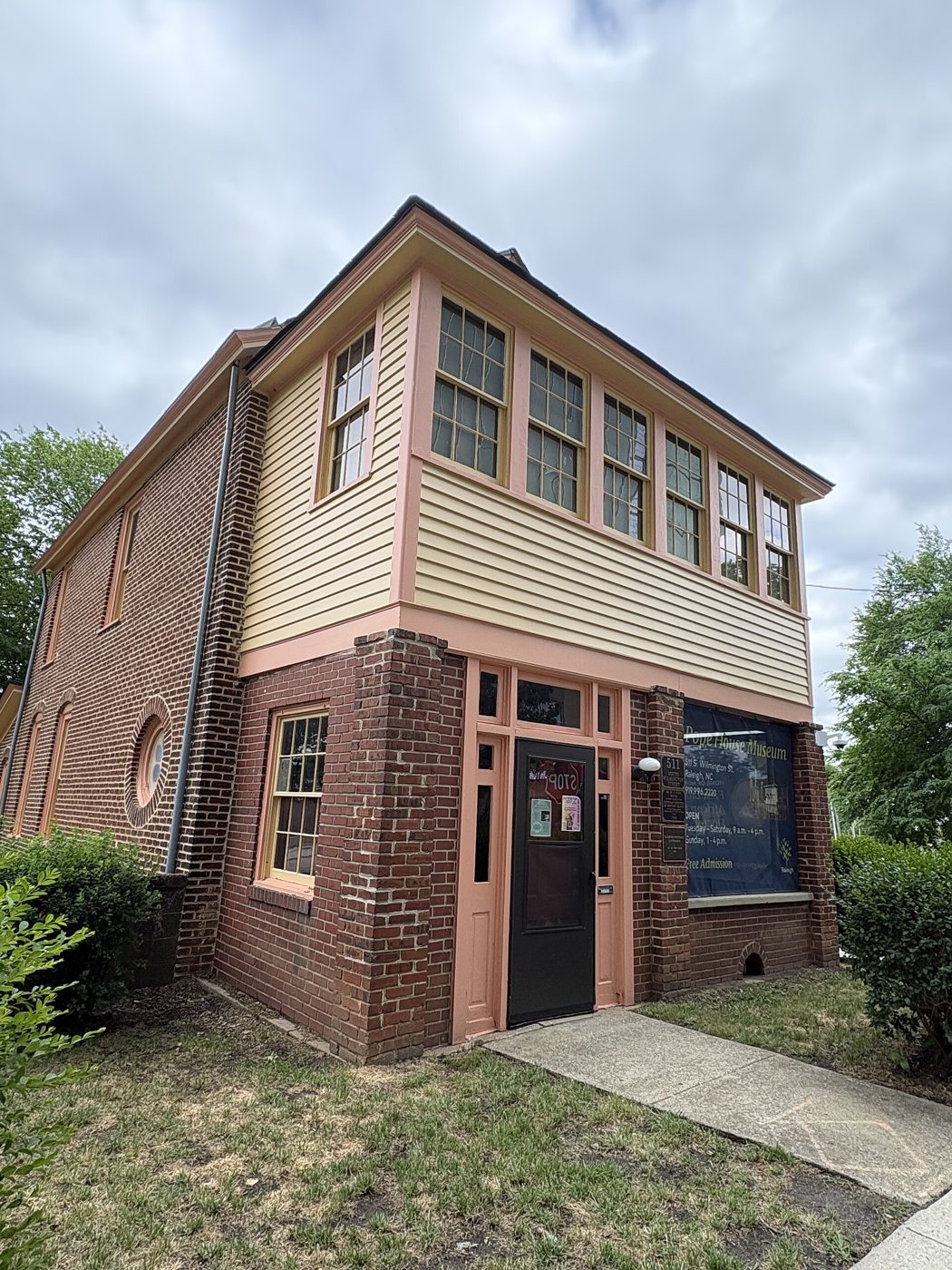 The Pope House Museum, a two-story brick and clapboard house in downtown Raleigh