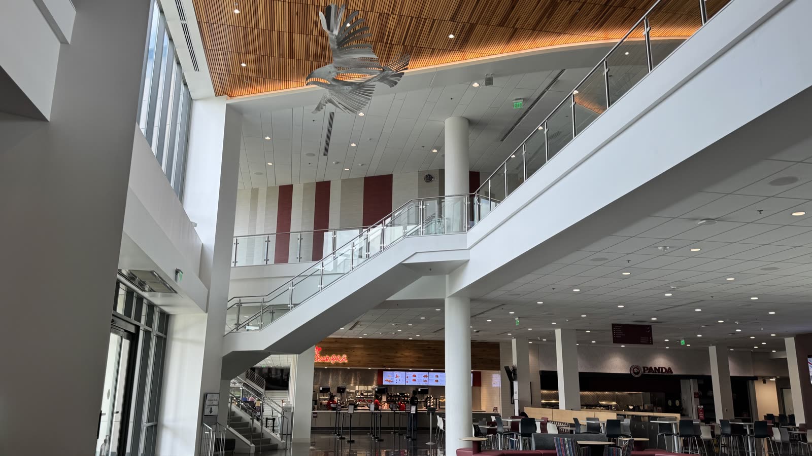 Two-story atrium of the NCCU Student Center with open staircase and eagle sculpture